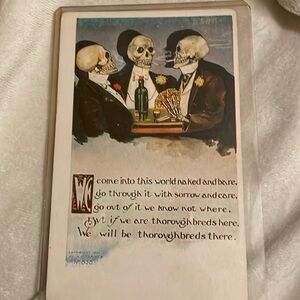 Antique post card- 3 well dressed skeletons (Dandies) playing cards